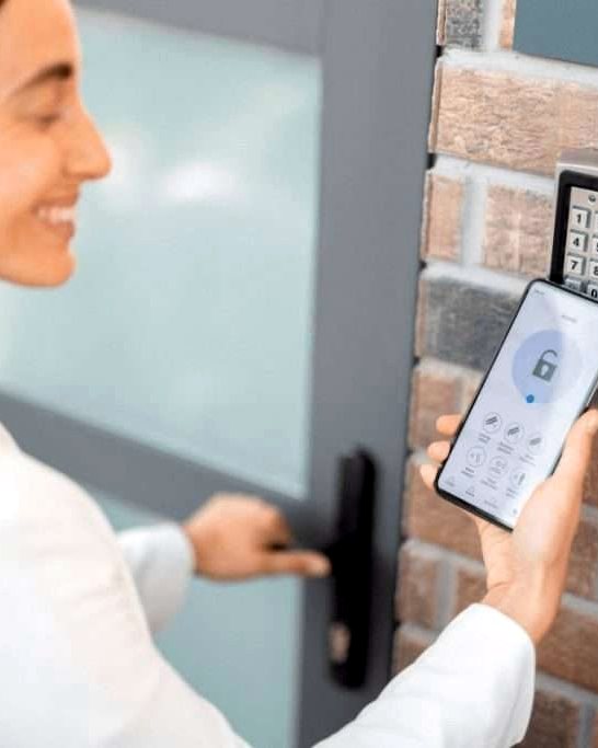 Keypad entry reader mounted beside a door