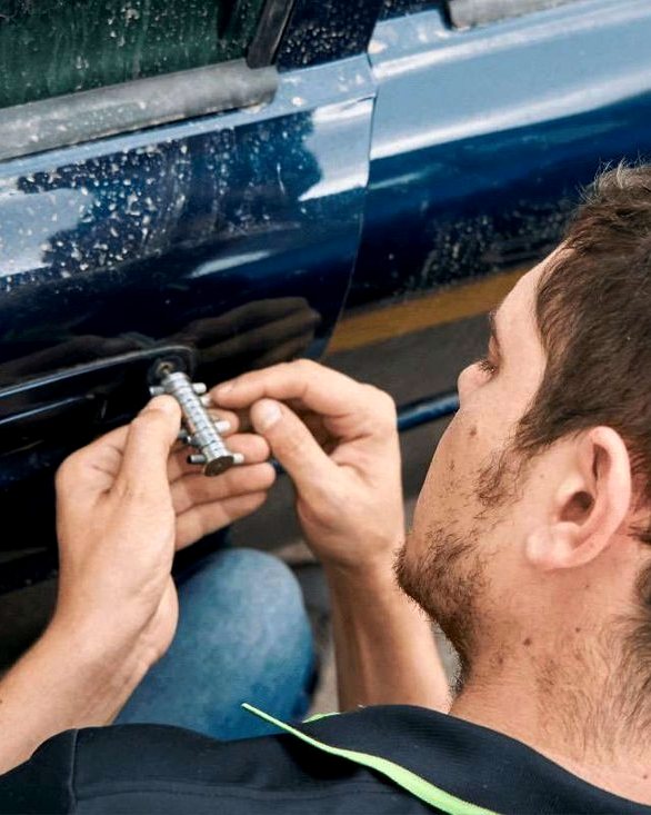 Technician working on a locked entry door