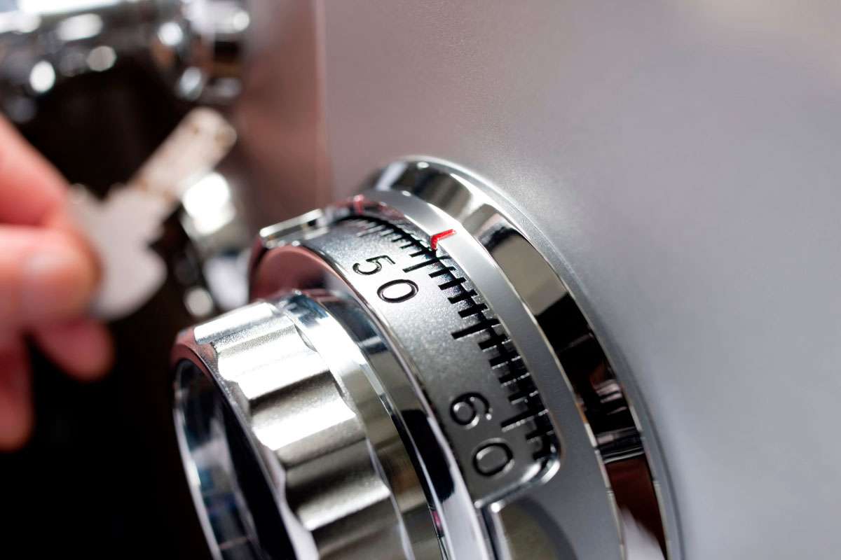 Locksmith technician working on a home safe